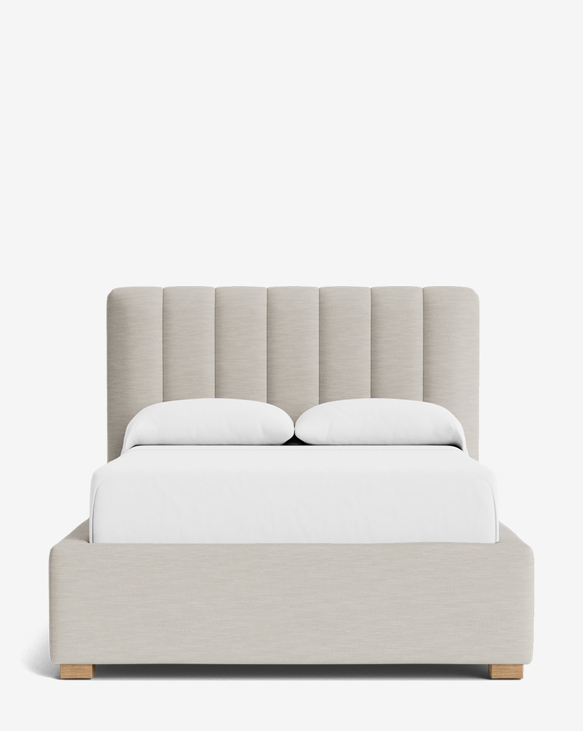 The Hoffman Bed Low Headboard showcases a sleek, customizable beige upholstered headboard, matching frame, and wooden feet. Styled with white bedding and two pillows, this modern bed stands out against a plain white background by Vendixs