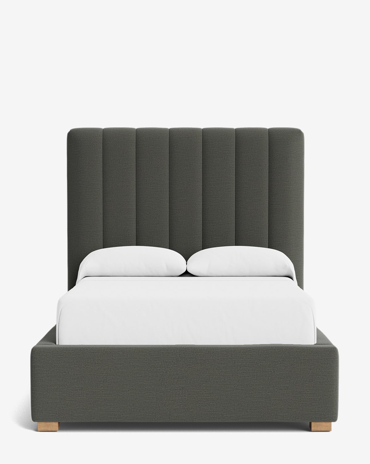 The Hoffman Bed Tall Headboard showcases a modern dark gray upholstered frame, tall vertically tufted headboard, white bedding, and light wooden legs on a plain white background. Available in customizable fabrics to suit your style, by Vendixs
