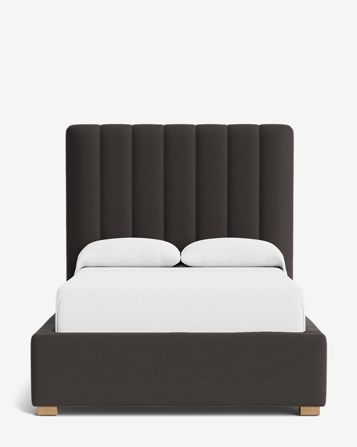 The Hoffman Bed Tall Headboard features vertically channeled dark gray upholstery with customizable fabrics, complemented by white bedding and pillows, all set against a plain white background, by McGee & Co.