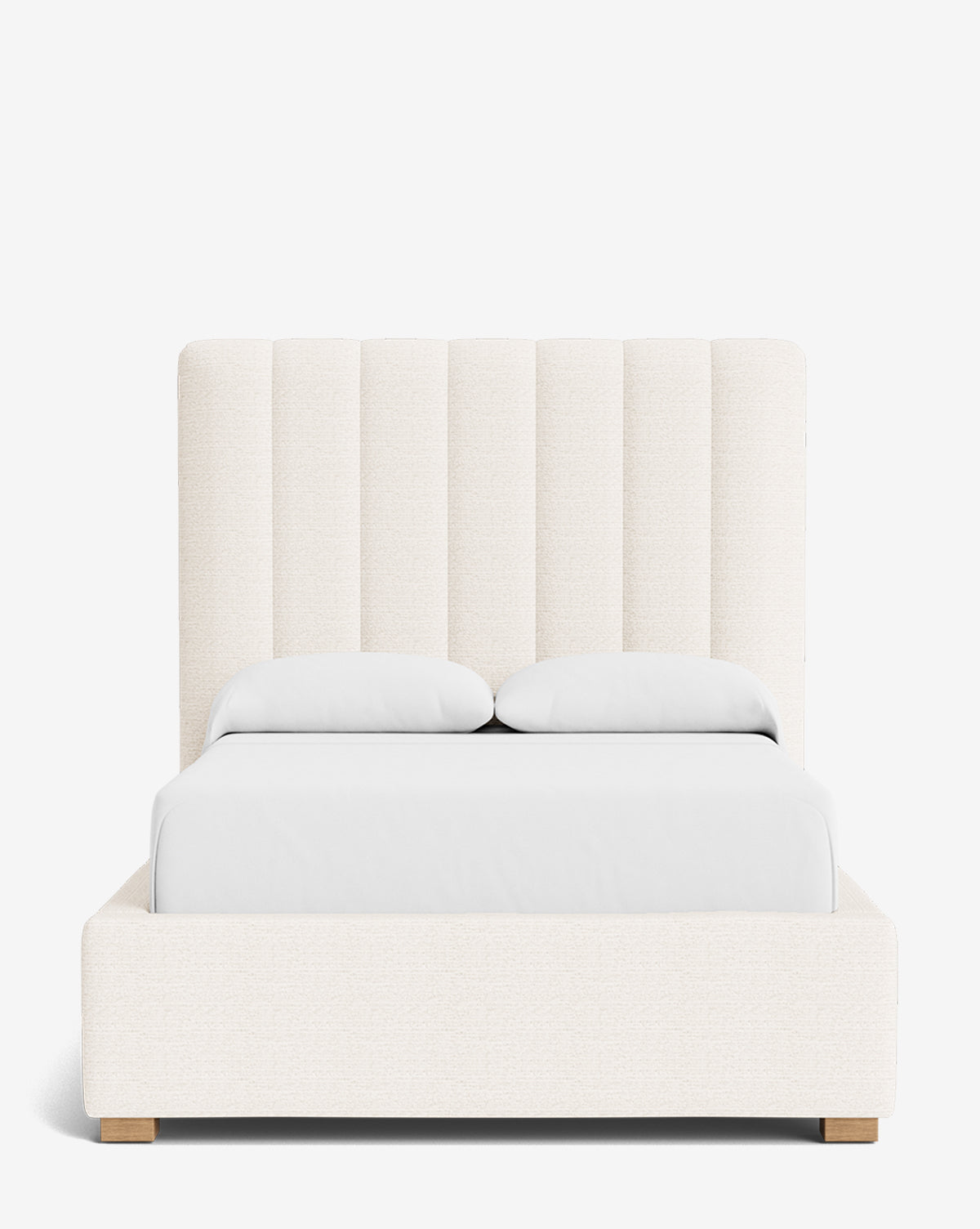 The Hoffman Bed Tall Headboard features vertical panels in light beige upholstery, a modern, simple design, customizable fabrics, white bedding options, and light wooden legs for a sleek look, by McGee & Co.