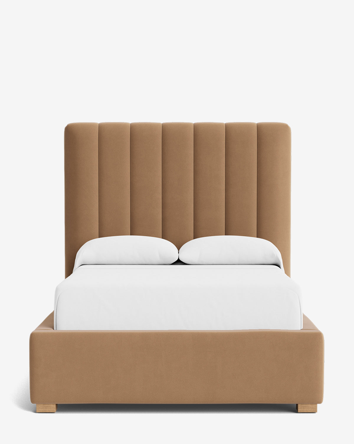 The Hoffman Bed Tall Headboard features a tall, vertically paneled tan upholstered headboard and frame with wooden legs. Shown with white bedding and two pillows, this bed is customizable in various fabrics to fit your style by McGee & Co.