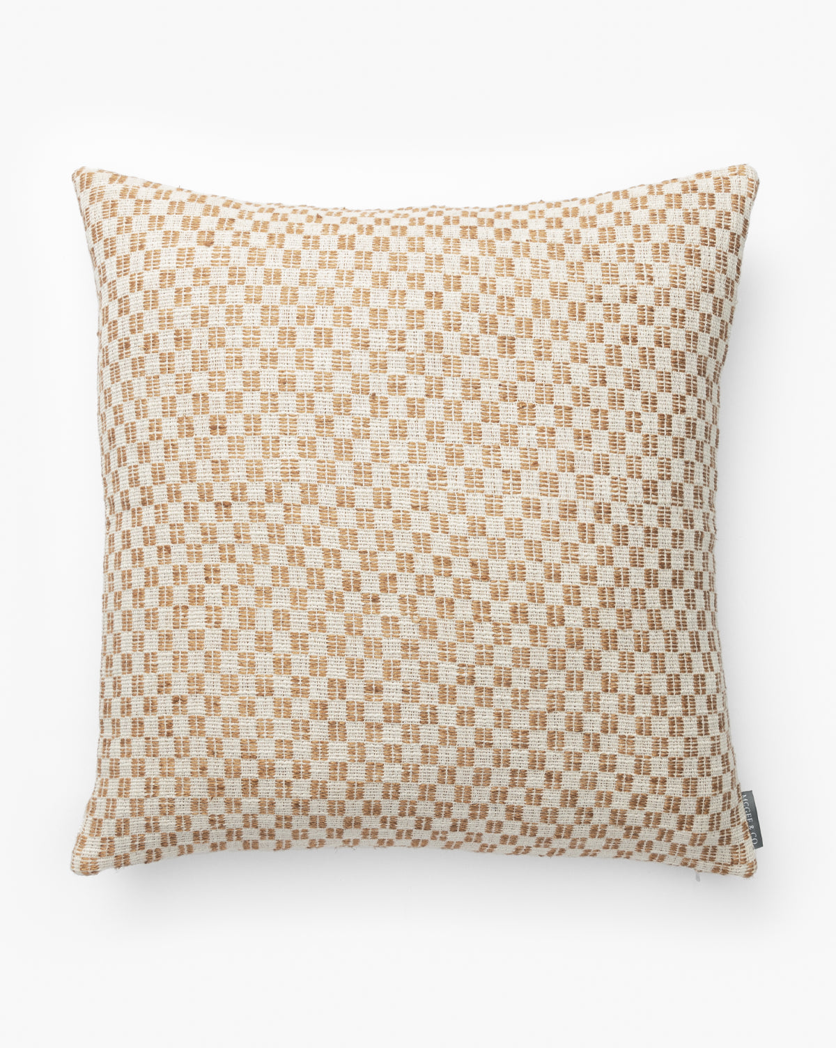 The Holscher Checkered Pillow Cover, shown on a white background, features a light beige and tan woven checkered pattern in cotton and linen with a small fabric tag for added detail, by Vendixs