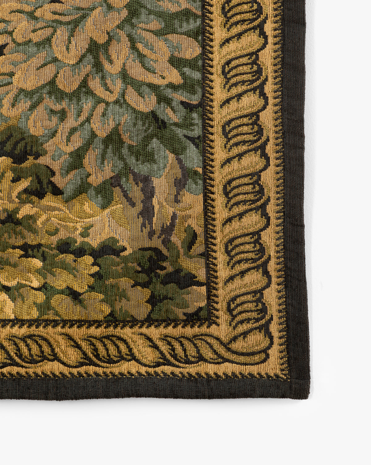 Close-up of the Hortensia Wall Tapestry corner, showcasing leafy green foliage in yellow and brown tones, framed by an ornate gold and black decorative border, by Vendixs