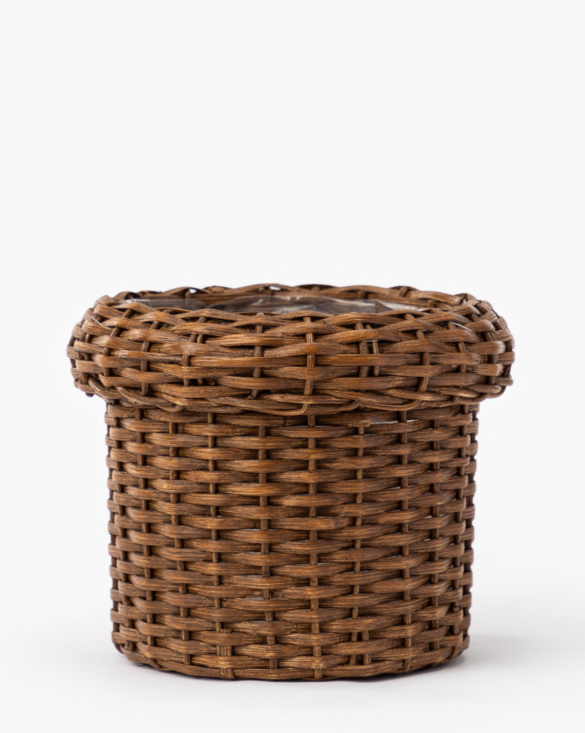 The Huger Woven Planter is a round, brown wicker planter with a wide, slightly flared rim and intricate woven details, shown against a plain white background, by Vendixs