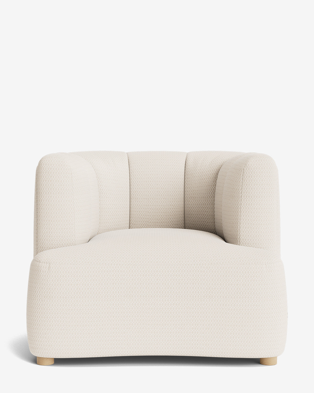 The Ines Lounge Chair is a modern, low-profile seat with textured off-white upholstery, rounded edges, a wide seat, and subtle vertical stitching on the backrest, shown against a plain white background by McGee & Co.