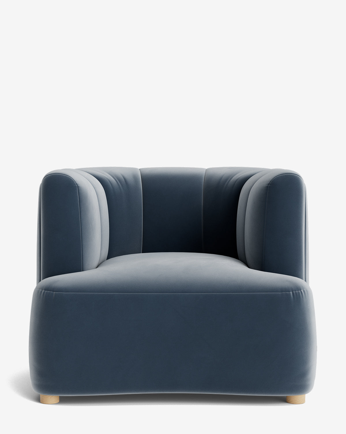 The Ines Lounge Chair showcases deep blue velvet upholstery, a rounded plush design, and subtle wooden feet, photographed from the front against a plain white background by McGee & Co.