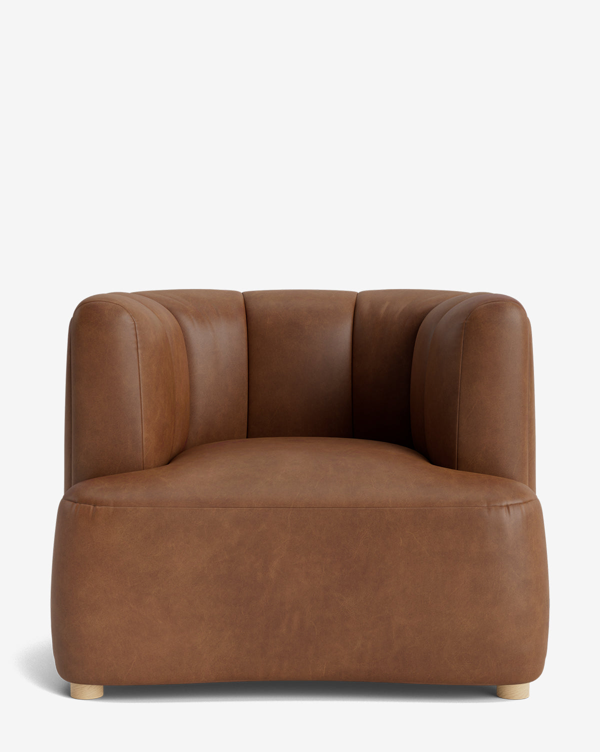 The Ines Lounge Chair features a modern, wide design with low arms, smooth brown leather upholstery, subtle stitching, rounded edges, and short wooden legs, shown against a plain white background by McGee & Co.