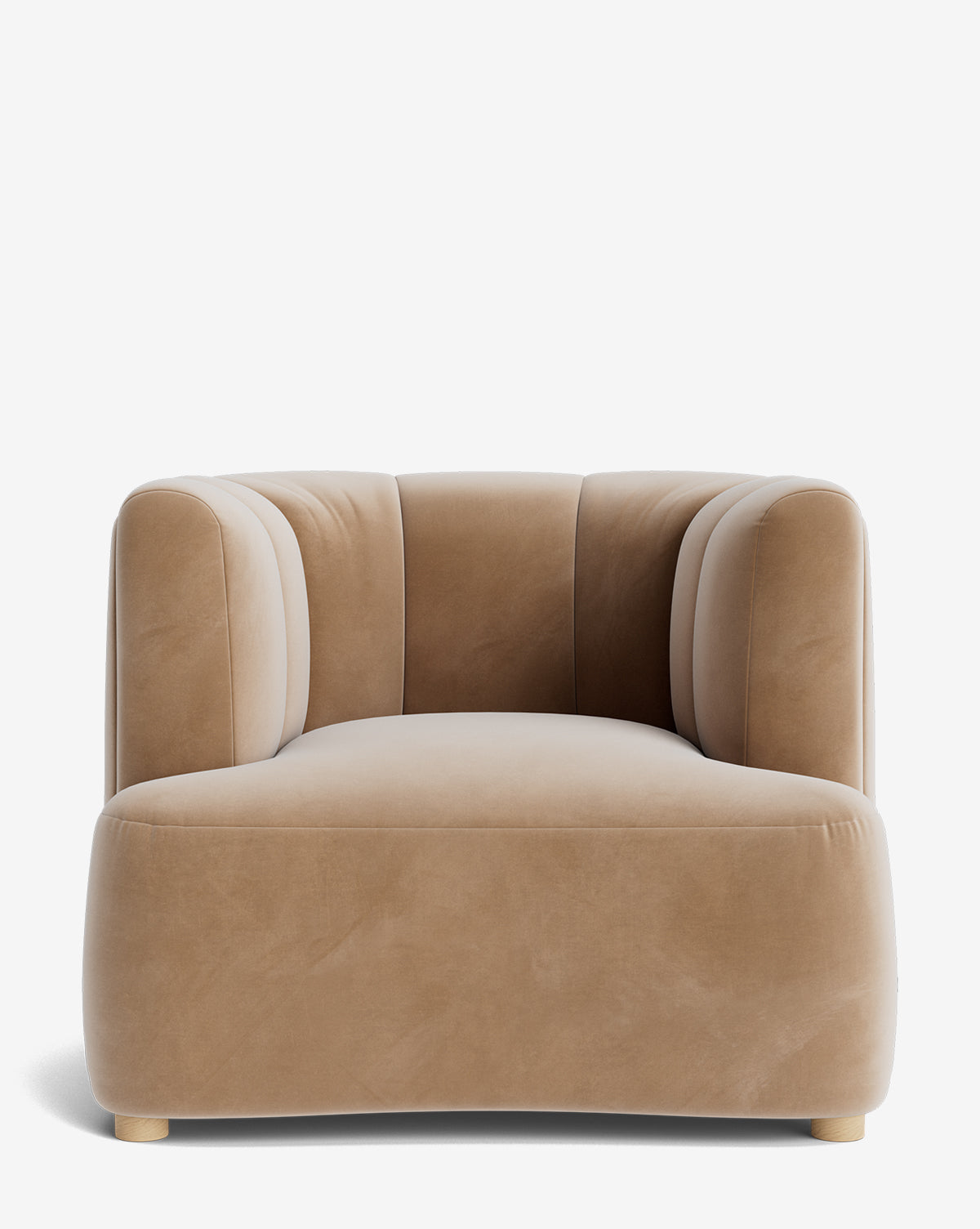The Ines Lounge Chair features tan velvet upholstery, a modern curved design, vertical-stitched backrest, and short light wood legs. Shown from the front against a plain white background by McGee & Co.