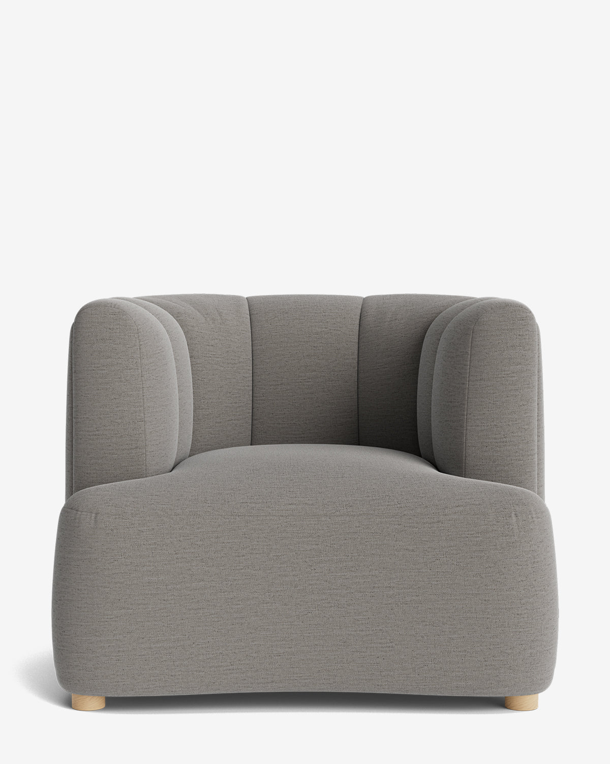The Ines Lounge Chair features light gray upholstery, rounded edges, a wide cushioned seat, and short light wooden legs. With its minimalistic design, it is shown against a white background by McGee & Co.