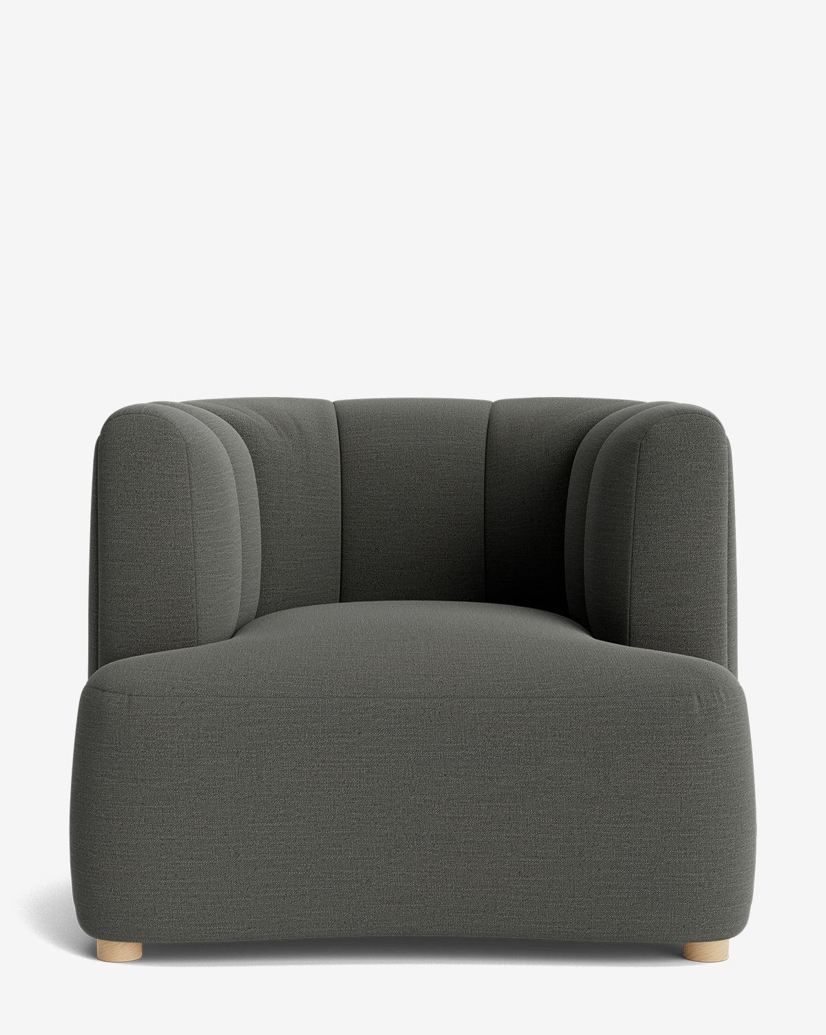 The Ines Lounge Chair is a modern, dark gray velvet seat featuring rounded edges, a low back, and short wooden legs, displayed against a plain white background by McGee & Co.