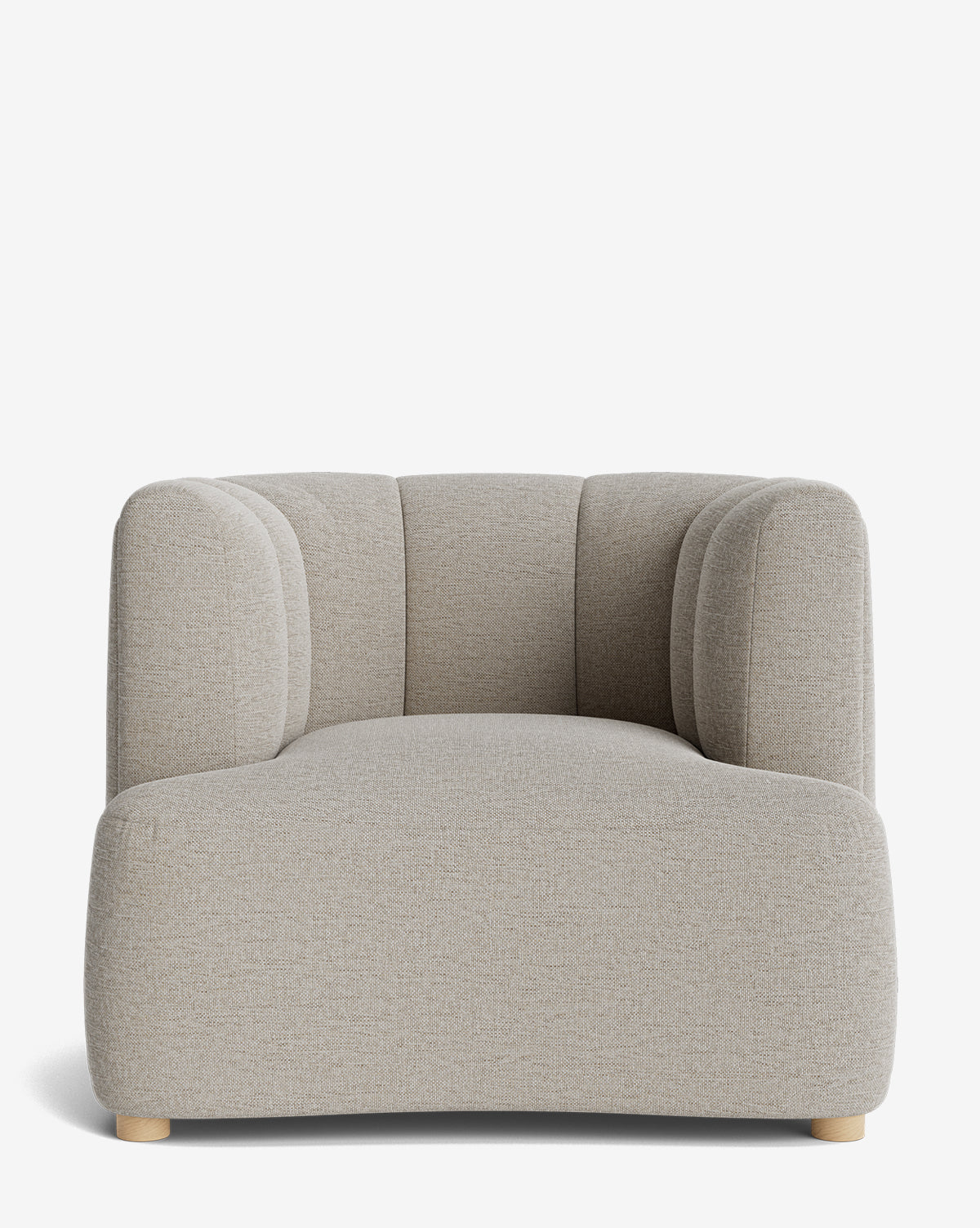 The Ines Lounge Chair, featuring a modern light beige design with a low, wide seat, rounded edges, and subtle vertical stitching on the backrest, is displayed against a white background by McGee & Co.