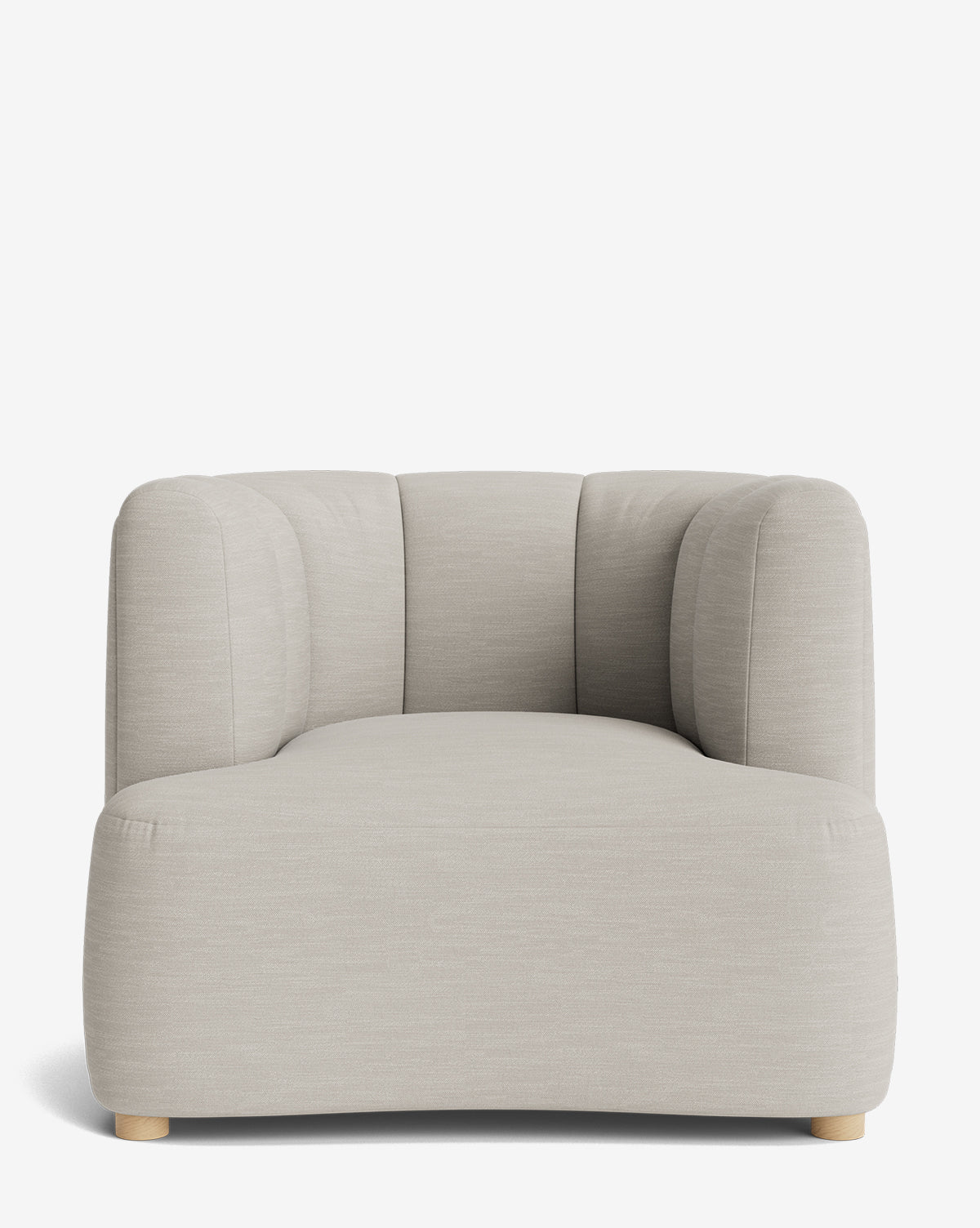 The Ines Lounge Chair is a modern chaise lounge upholstered in light beige fabric, featuring soft, rounded edges and low wooden feet, displayed against a plain white background by McGee & Co.