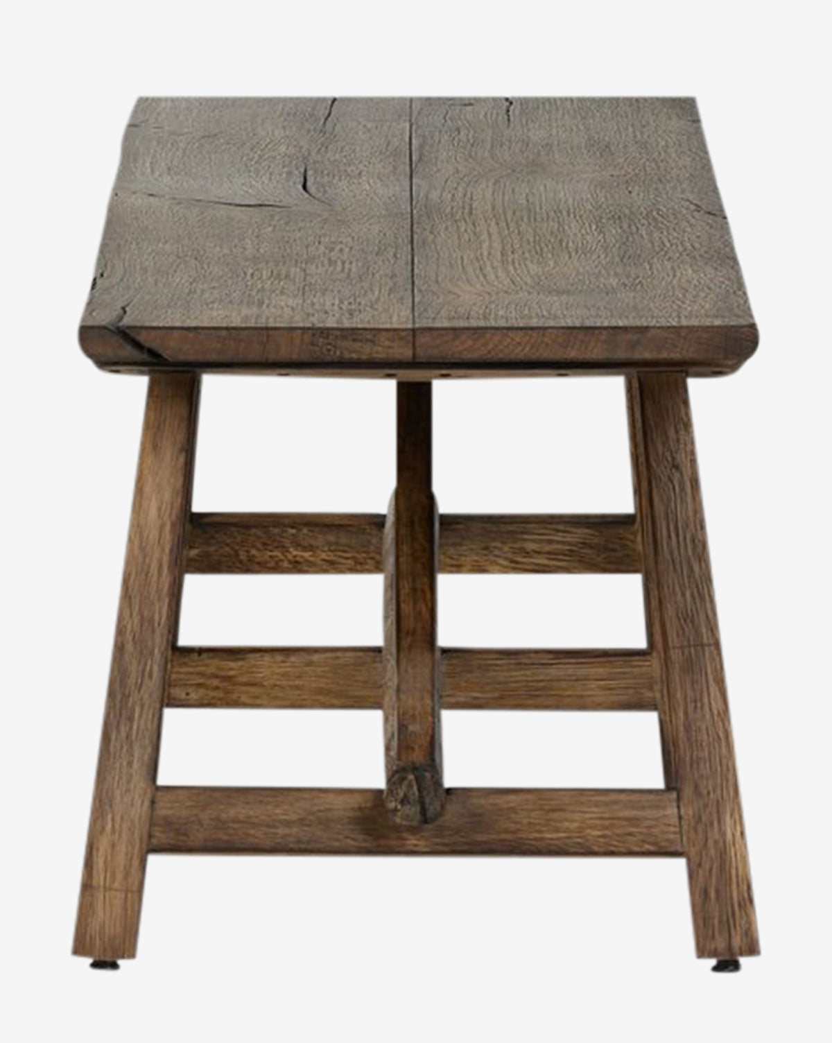The Inka Bench is a rustic, artisanal piece with a wide rectangular seat and sturdy angled legs, crafted from burnt bleached oak to showcase natural grain and cracks—highlighting expert craftsmanship, by Vendixs