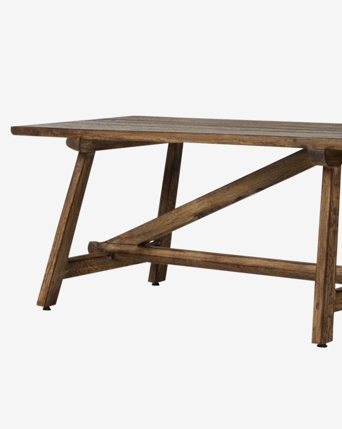 The Inka Bench features a rectangular wooden top and angled legs with cross-bracing for support. Its burnt bleached oak finish highlights rustic charm and artisanal craftsmanship by McGee & Co.