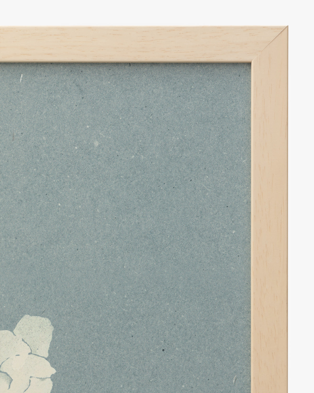 A close-up of the top right corner of the Iris Ink Block shows a wooden frame, blue background, and white floral design—perfect wall art to brighten up childrens room decor, by Vendixs
