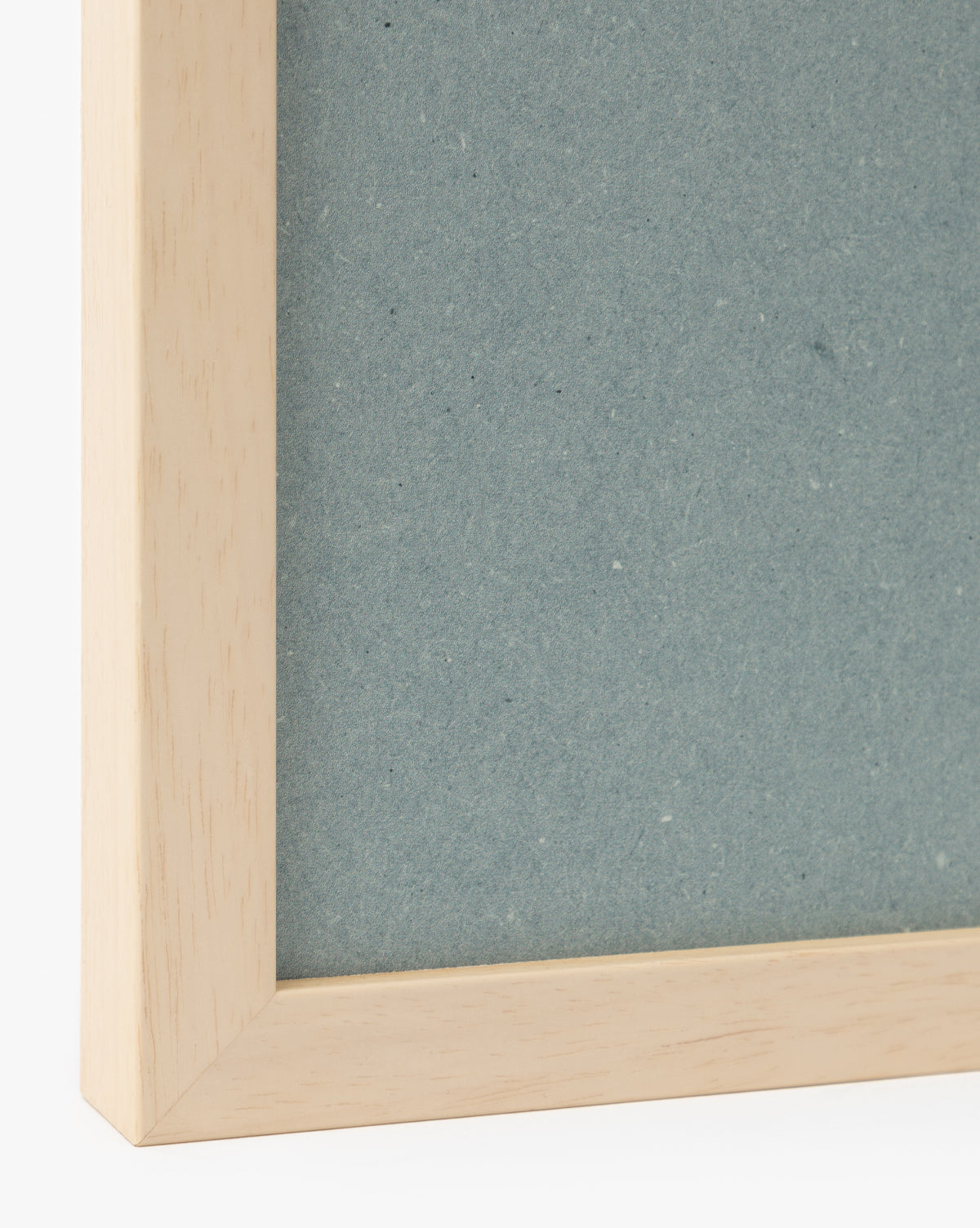 A close-up of the Iris Ink Block picture frame shows its light wood border and textured blue backing, highlighting clean lines and minimalist design—ideal for displaying iris-themed wall art in childrens room decor, by Vendixs