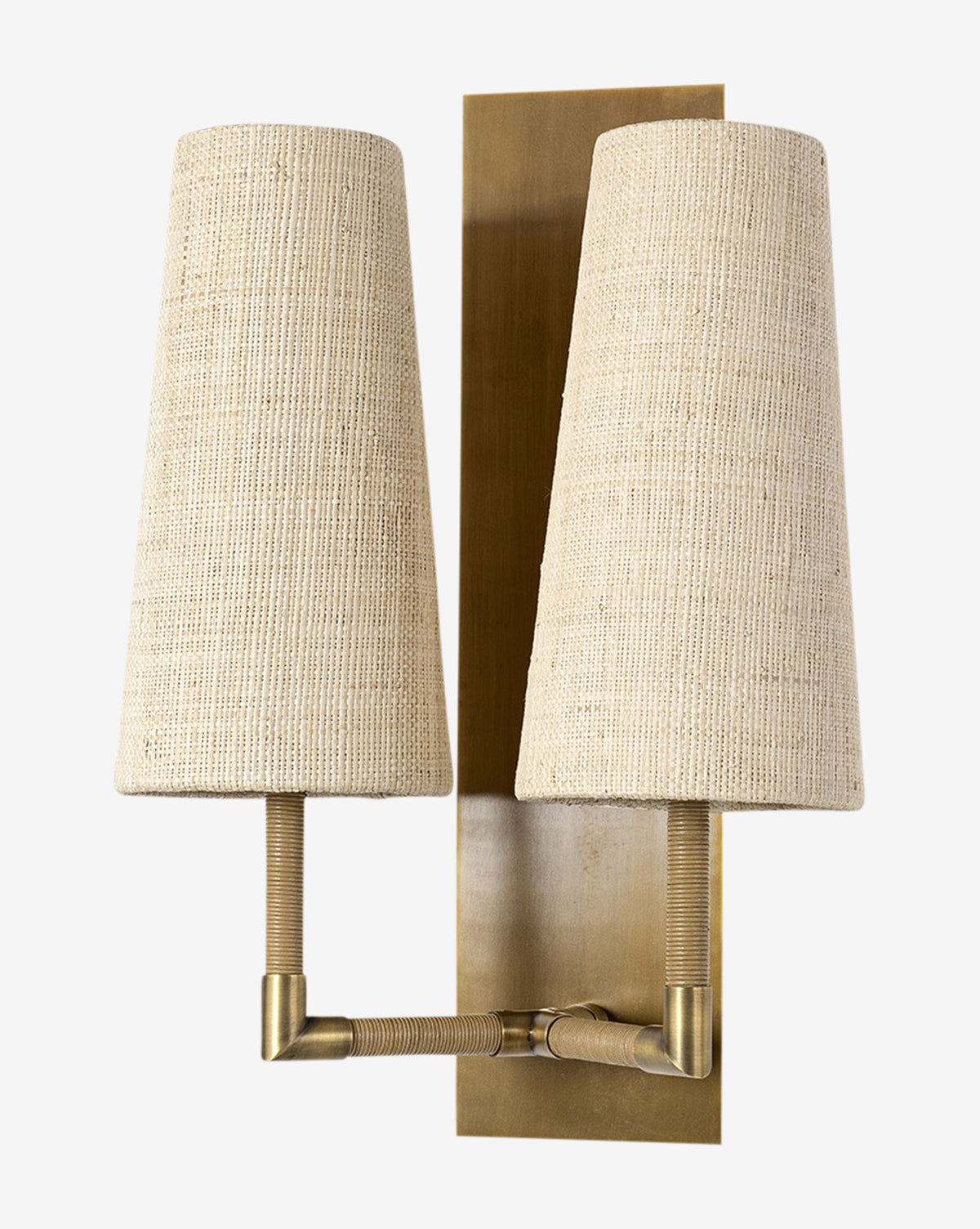 The Irving Sconce combines two cream raffia shades and leather-wrapped arms on a brass backplate, achieving a modern design, by McGee & Co.