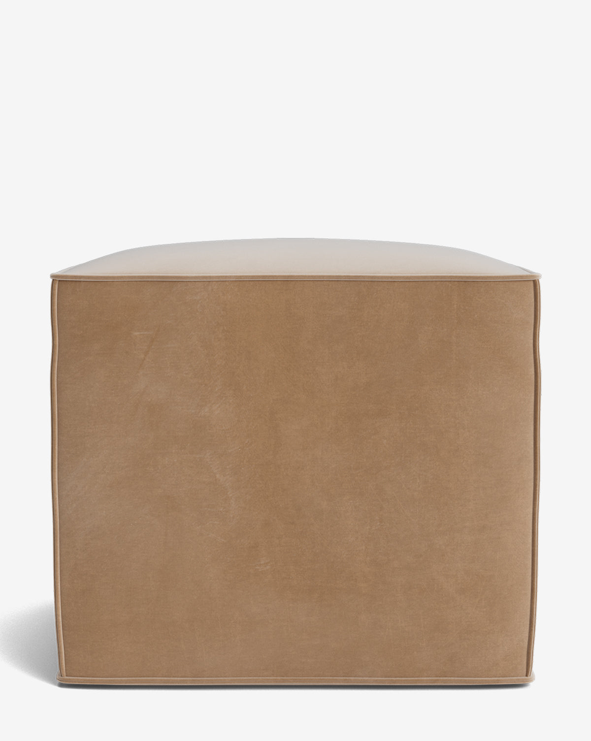 The Johannes Cube is a cube-shaped light brown leather pouf ottoman with visible edge stitching, offering a stylish cushioned seat, pictured on a white background by Vendixs