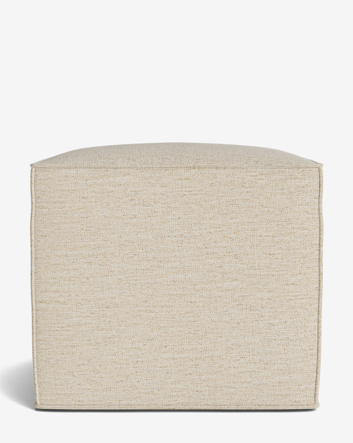 The Johannes Cube is a beige, square fabric ottoman with a cushioned seat and minimalist design, shown against a white background. This made-to-order piece adds understated elegance to any space, by Vendixs