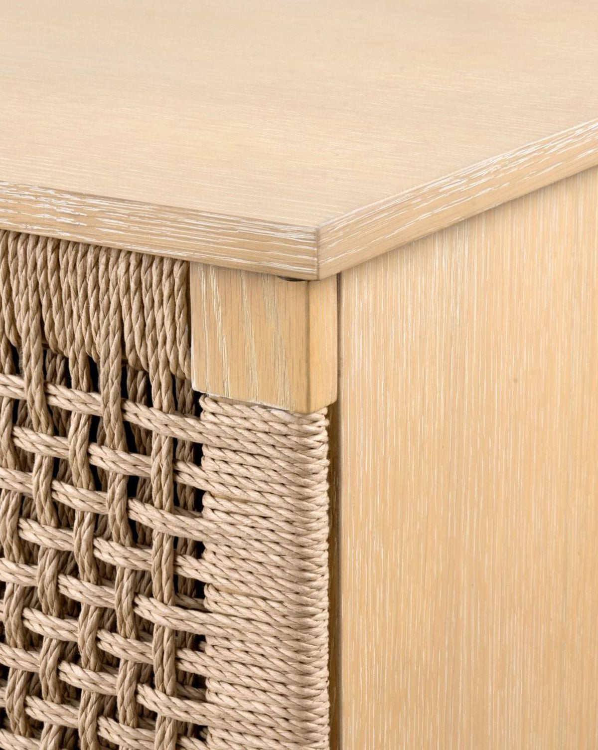 Close-up of the Jovan Cabinet corner showing a woven rope front panel, highlighting natural textures and a smooth matte oak wood finish, by Vendixs