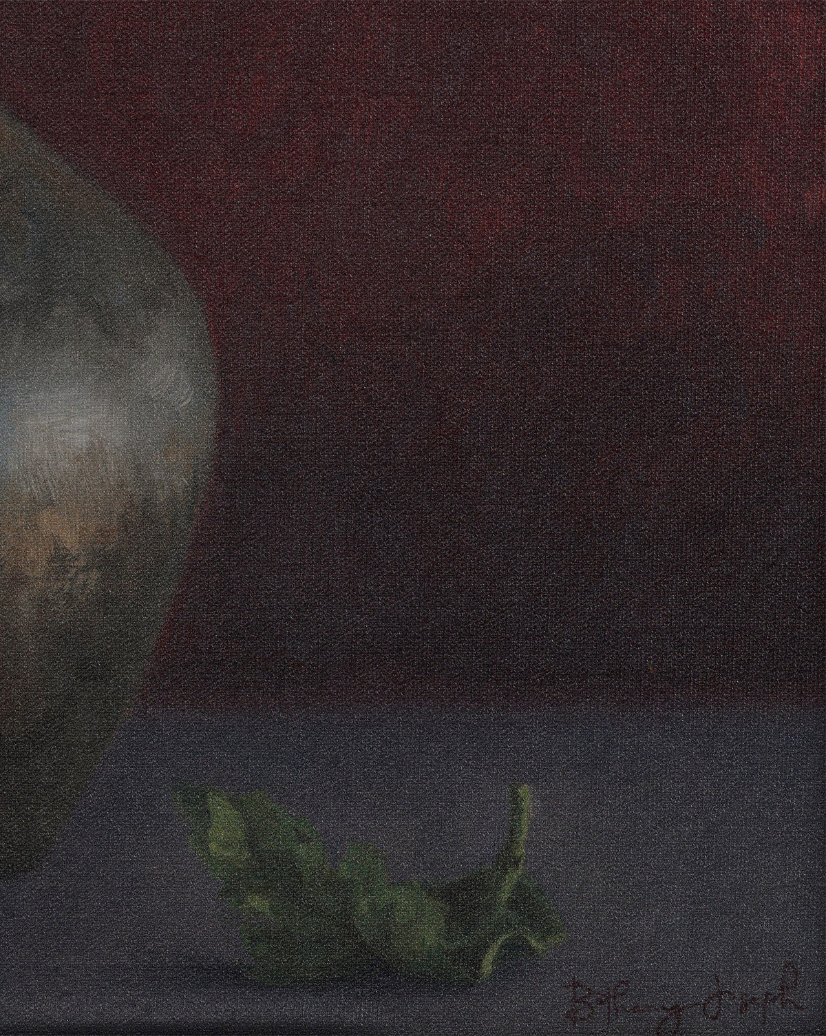 A single green leaf rests beside the curved edge of Jubilee by Bethany Joseph, a handmade metallic pot crafted in Austin, set against a deep red background with soft lighting that evokes a moody, contemplative atmosphere, by Vendixs