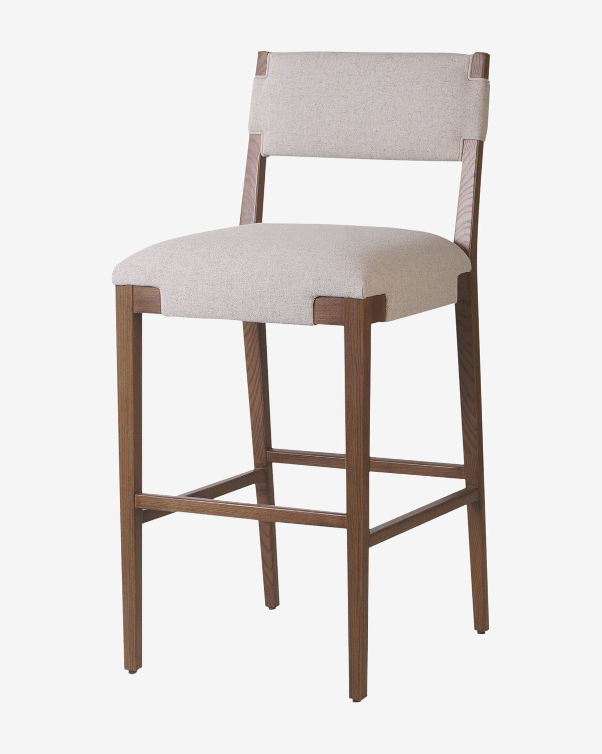 The Kennebec Stool by Four Hands features a light beige performance fabric seat and backrest, medium brown ash frame, and footrest bar for modern kitchen seating. Vendixs