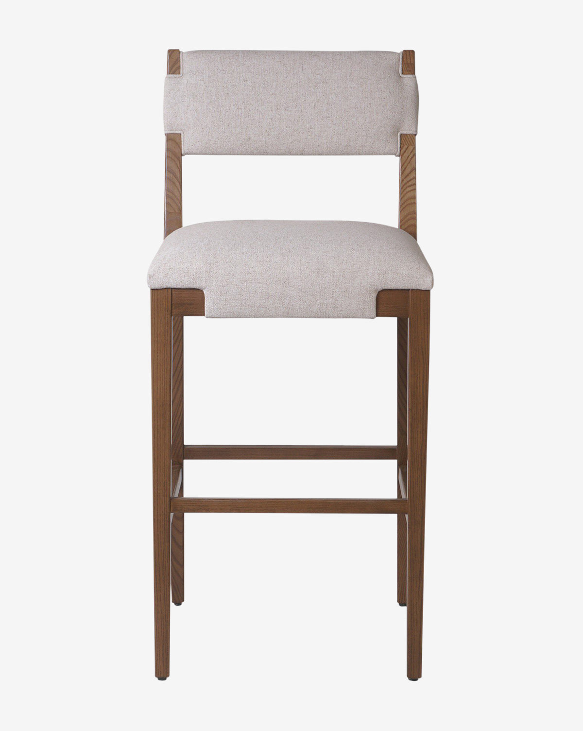 The Kennebec Stool by Four Hands features a wooden ash frame, light beige performance fabric upholstery on the seat and backrest, and straight legs. Shown from the front against a white background, it offers a simple, modern design by Vendixs