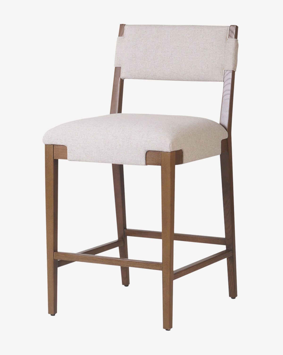The Kennebec Stool by Four Hands features a modern design with clean lines, a medium brown wood frame, low back, footrest, and a light beige performance fabric upholstered seat and backrest by Vendixs