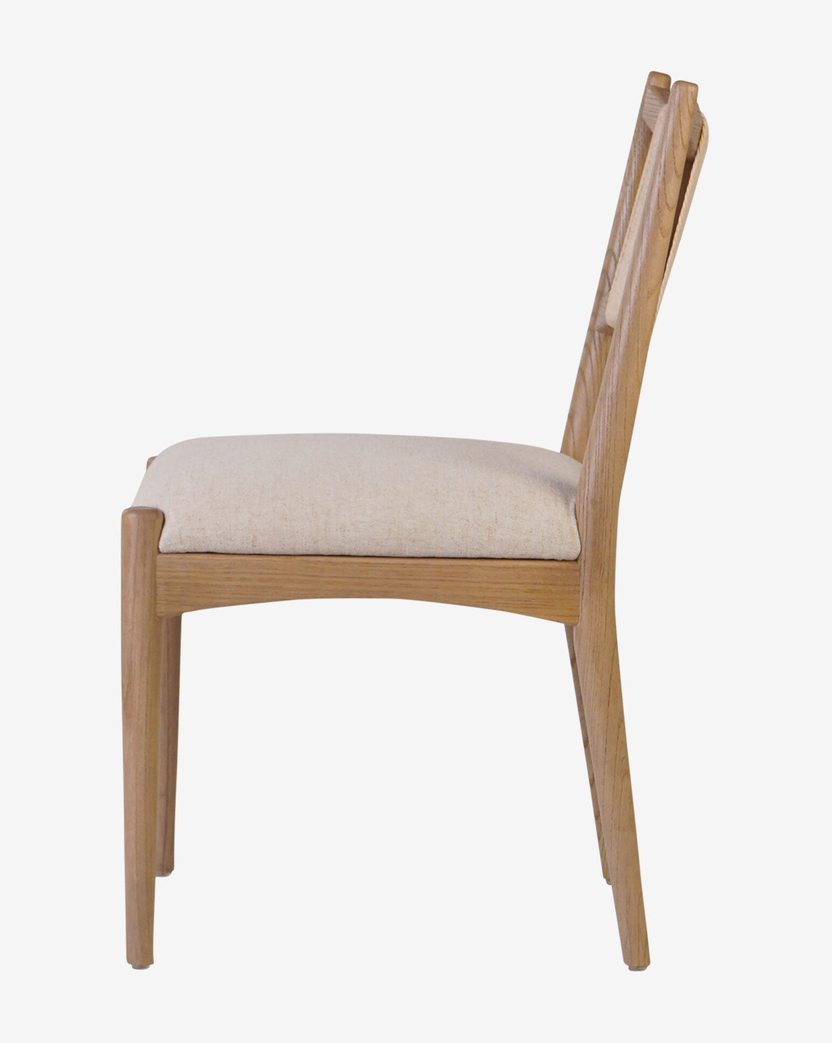 The Kimball Dining Chair features a sturdy wood frame, smooth clean lines, and a light beige upholstered seat in a minimalist design—shown in side profile view, it perfectly captures modern dining style, by Vendixs