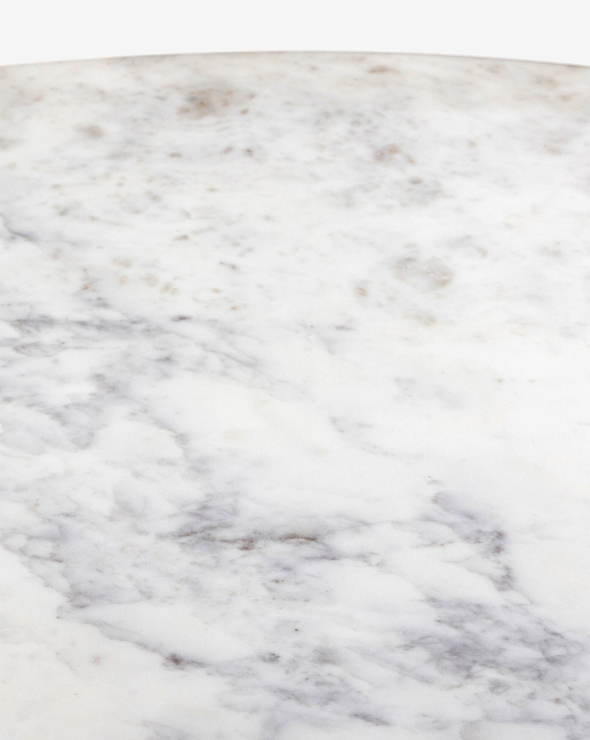 Close-up of the Kinlaw 60 Round Dining Table, showcasing its smooth white marble tabletop with gray veining and subtle brownish spots, by Vendixs