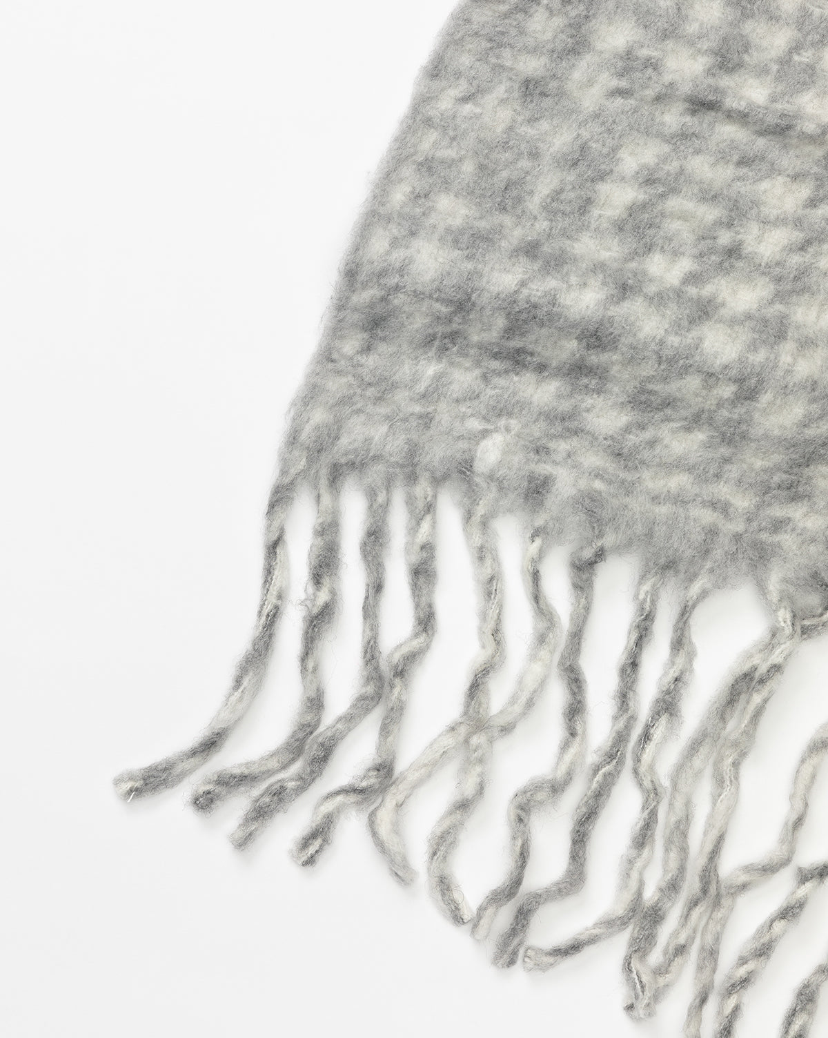 The Indaba Kirsley Houndstooth Throw features a soft wool-blend in gray and white houndstooth with long, twisted fringe, shown close-up against a white background. Vendixs