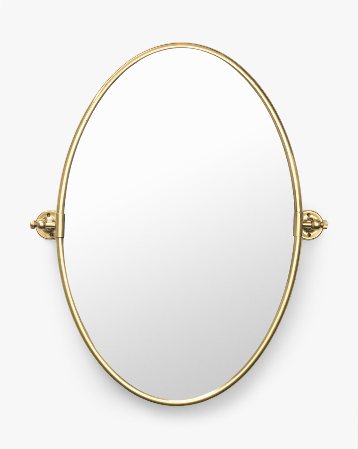 The Kitson Oval Mirror has a thin antique brass metal border and two side brackets for mounting, shown against a plain white background by Vendixs