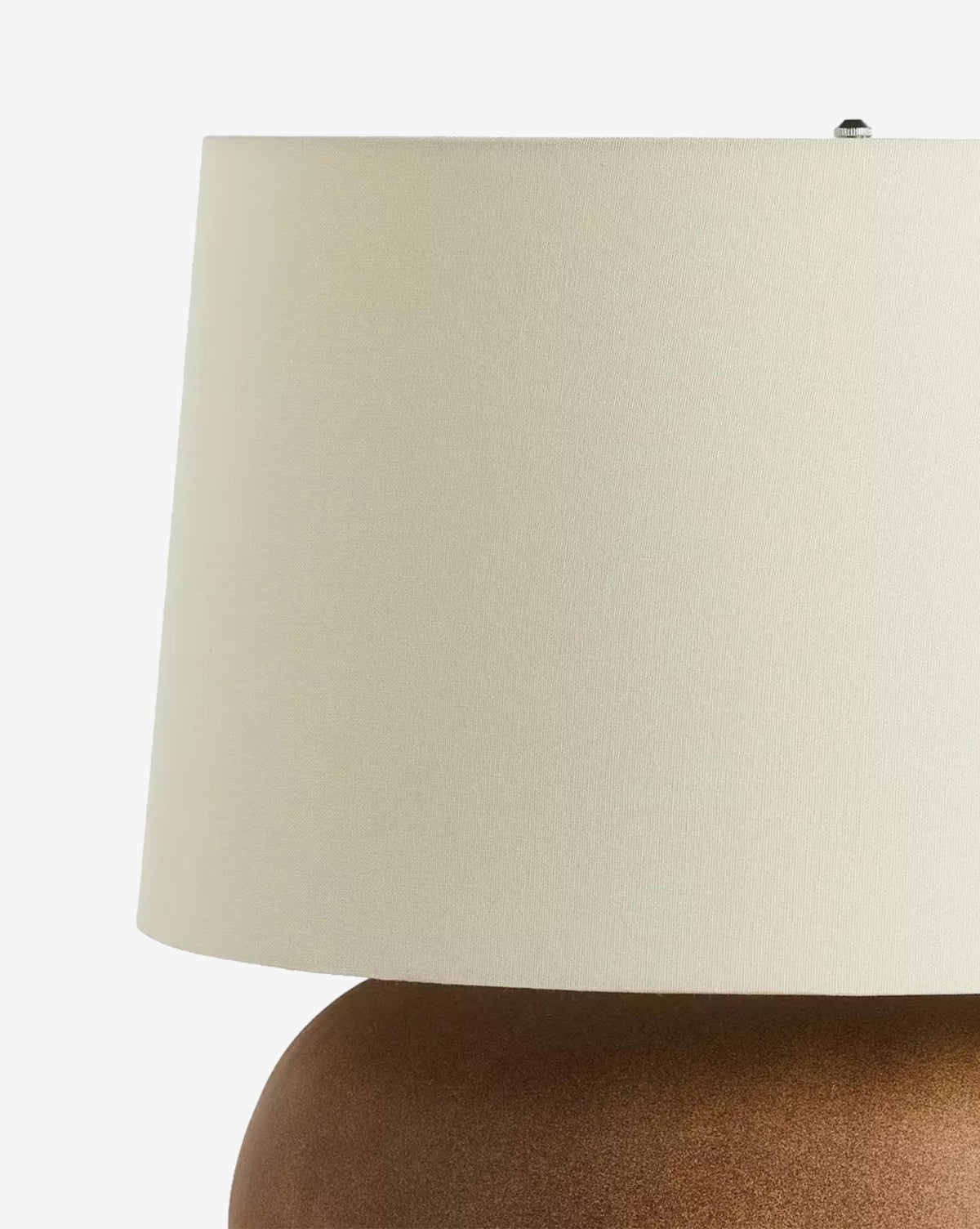 A close-up of the Kragen Table Lamp, featuring a large ivory linen shade atop a rounded brown ceramic base, displayed against a plain white background, by Vendixs