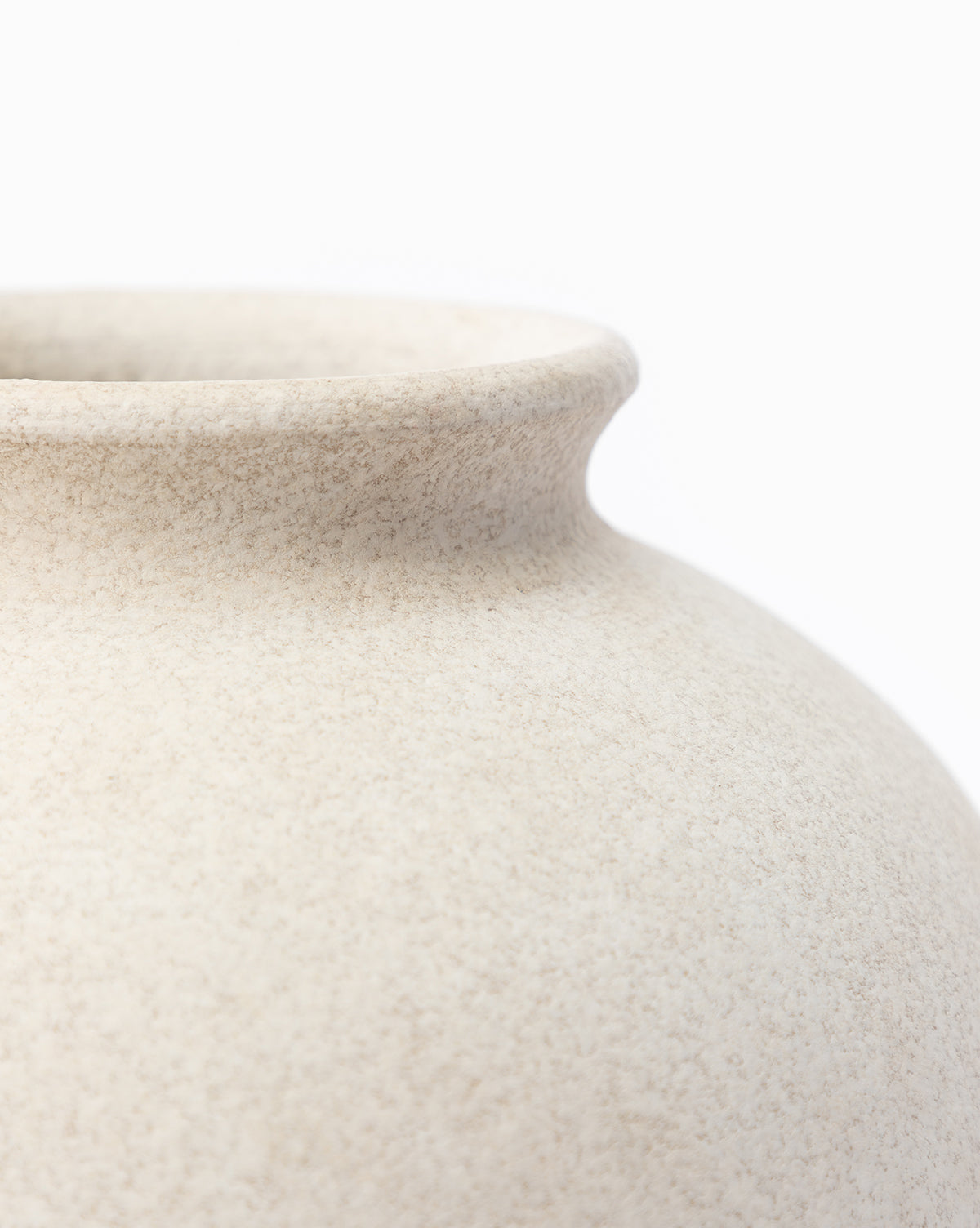 Close-up of the rim and upper body of the Krissan Vase, highlighted by its pebbled white finish, set against a plain white background, by Vendixs