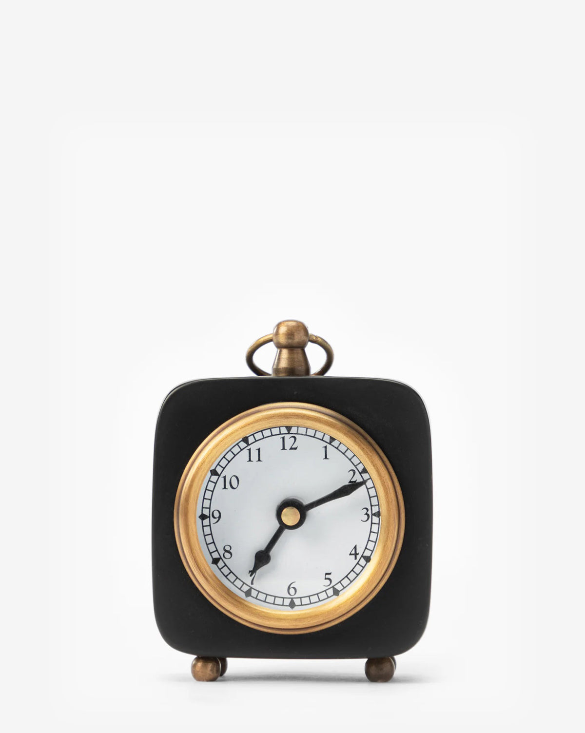 The Kya Clock is a small black accent clock with gold accents and round feet, displaying 8:14 on a plain white background—a stylish addition to any nightstand, by McGee & Co.