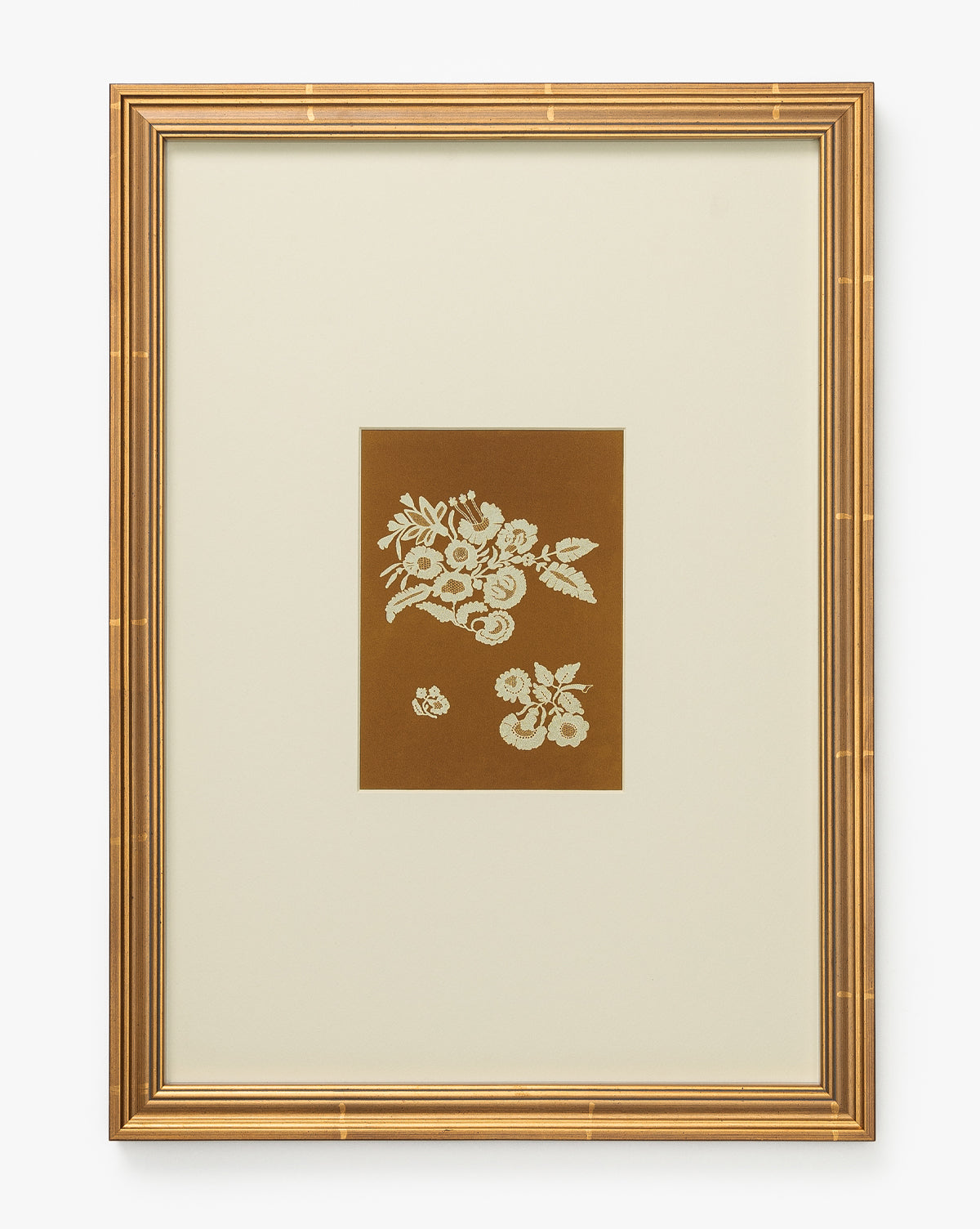 Add elegance to your home with Lace Detail, a gold-framed wall art featuring white lace floral motifs on a brown background, centered within a wide cream mat—an ideal piece for stylish and sophisticated decor, by Vendixs