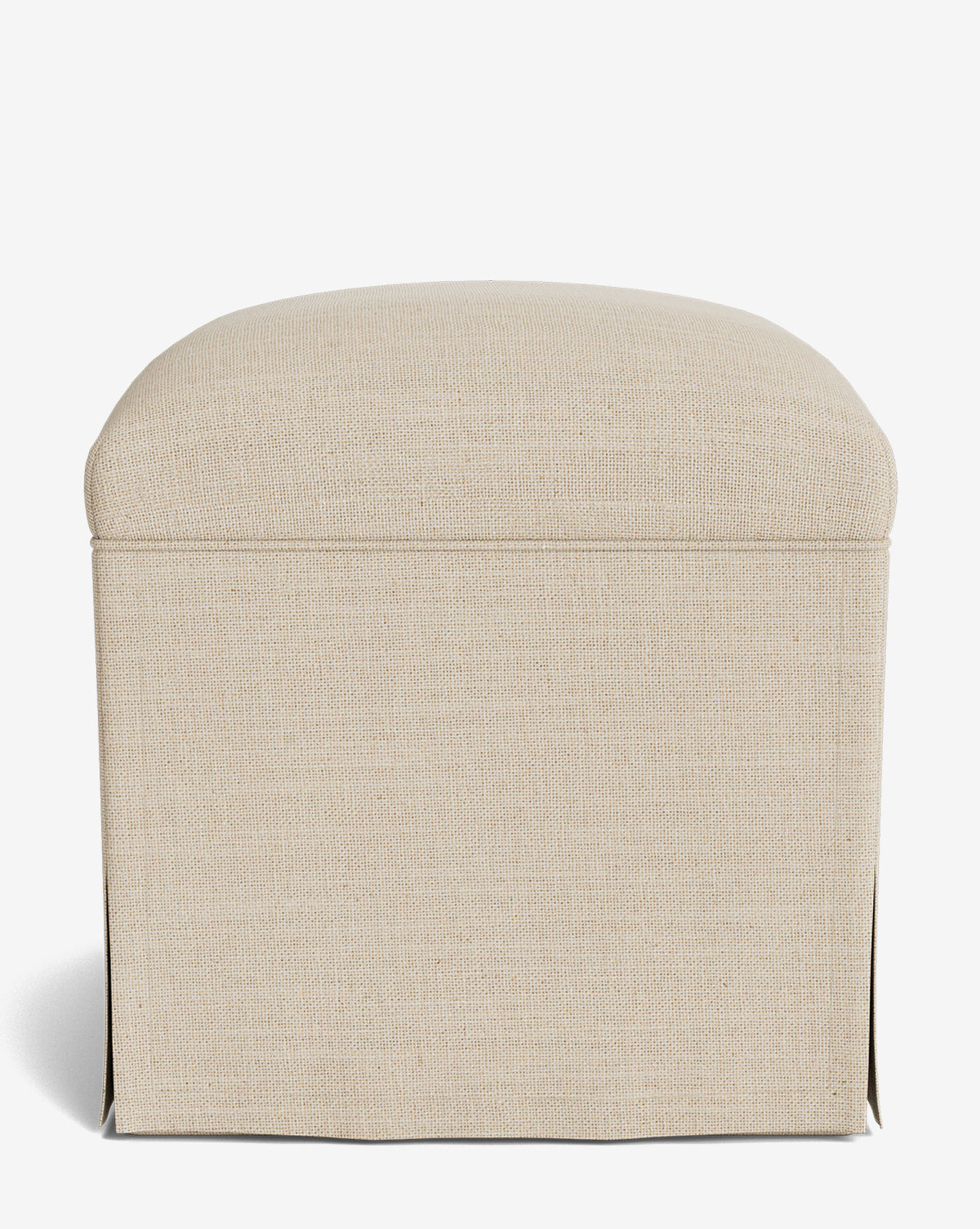 The Makerspalm Latimer Ottoman is a beige, square piece with a rounded padded top and elegant slip skirt base, displayed on a plain white background by Vendixs