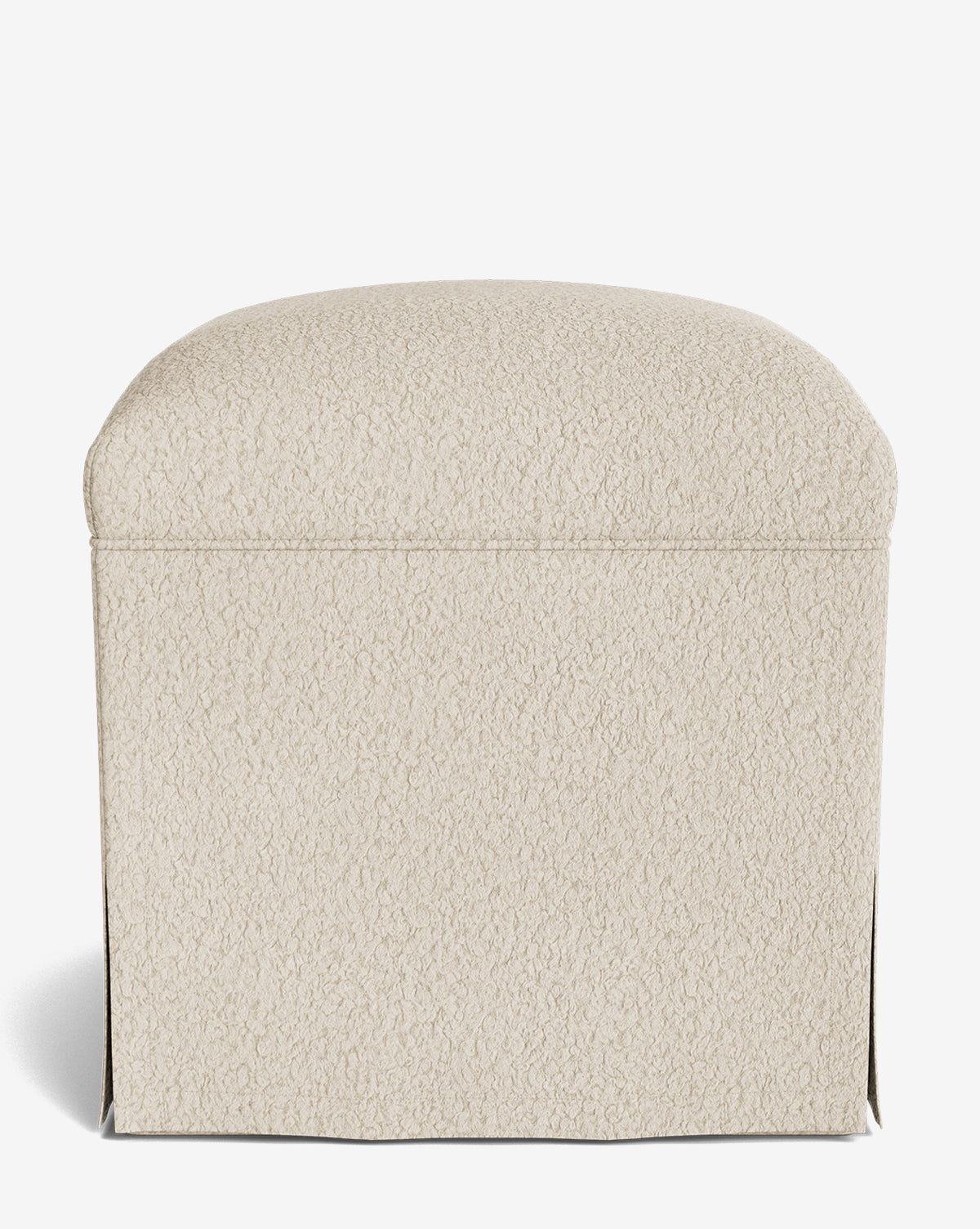 The Makerspalm Latimer Ottoman is a cream, square piece made from high-quality textured fabric with soft, rounded edges, shown on a plain white background. Vendixs
