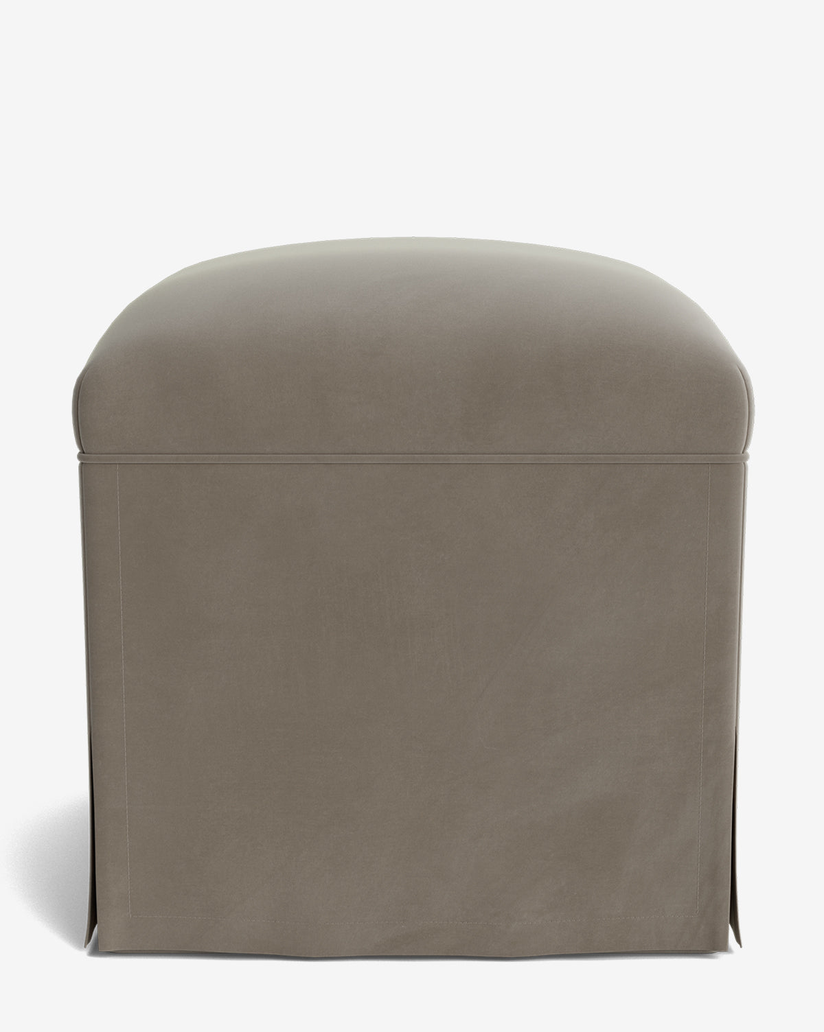 The Makerspalm Latimer Ottoman is a square piece in taupe, upholstered with high-quality fabric and a tailored skirt covering the sides, set against a white background. Vendixs
