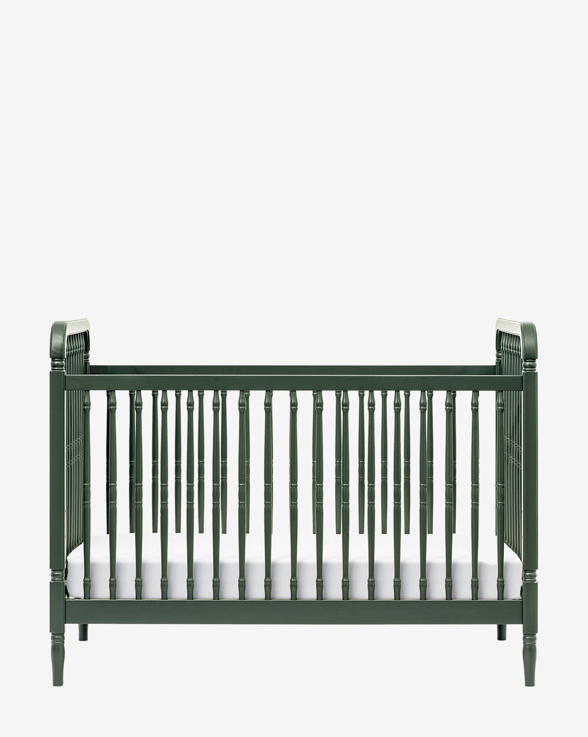 The Liberty 3-in-1 Convertible Spindle Crib with Toddler Bed Conversion Kit, shown here in dark green with vertical slats and classic legs, includes a white mattress and is displayed against a plain white background by Vendixs