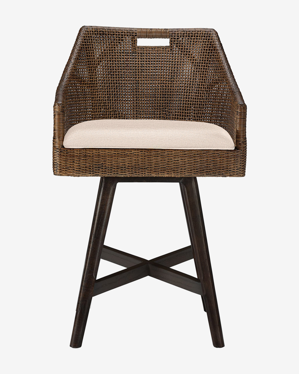 The Lilian Counter Stool by Made Goods features a brown rattan frame, beige upholstered seat, angled armrests, and dark wooden legs, displayed against a plain white background. Vendixs