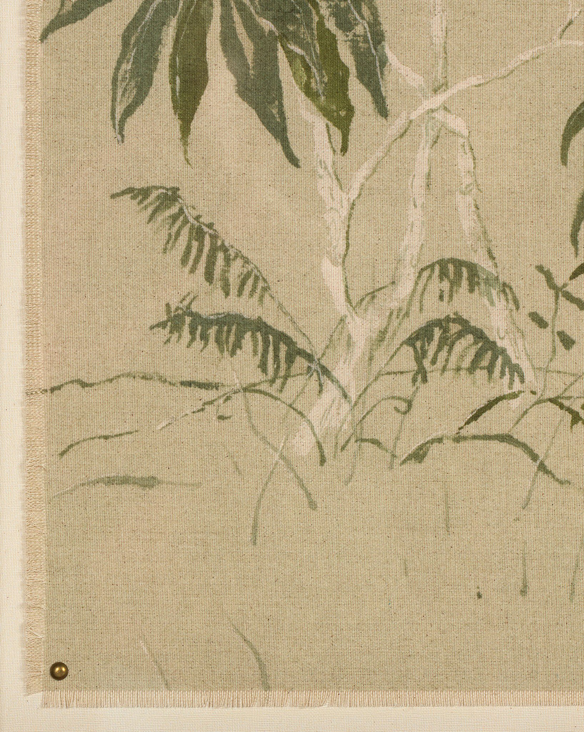 Linen Chinoiserie by Laurel-Dawn Latshaw features beige fabric with a subtle, painted design of leafy green plants and slim tree trunks—a modern take on chinoiserie. The textile is pinned at the bottom left corner with a small brass tack, by Vendixs