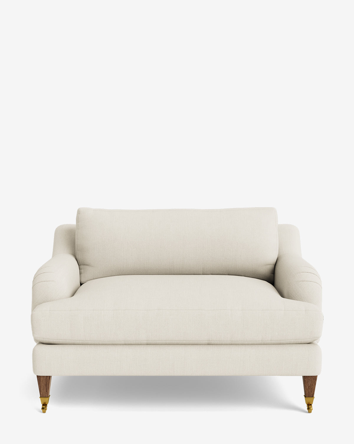 The Lucille English Roll Arm Chair and a Half is a cream-colored, upholstered loveseat featuring a single large down-wrapped cushion, rounded arms, and wooden legs with brass casters on the front set against a plain white background, by McGee & Co.