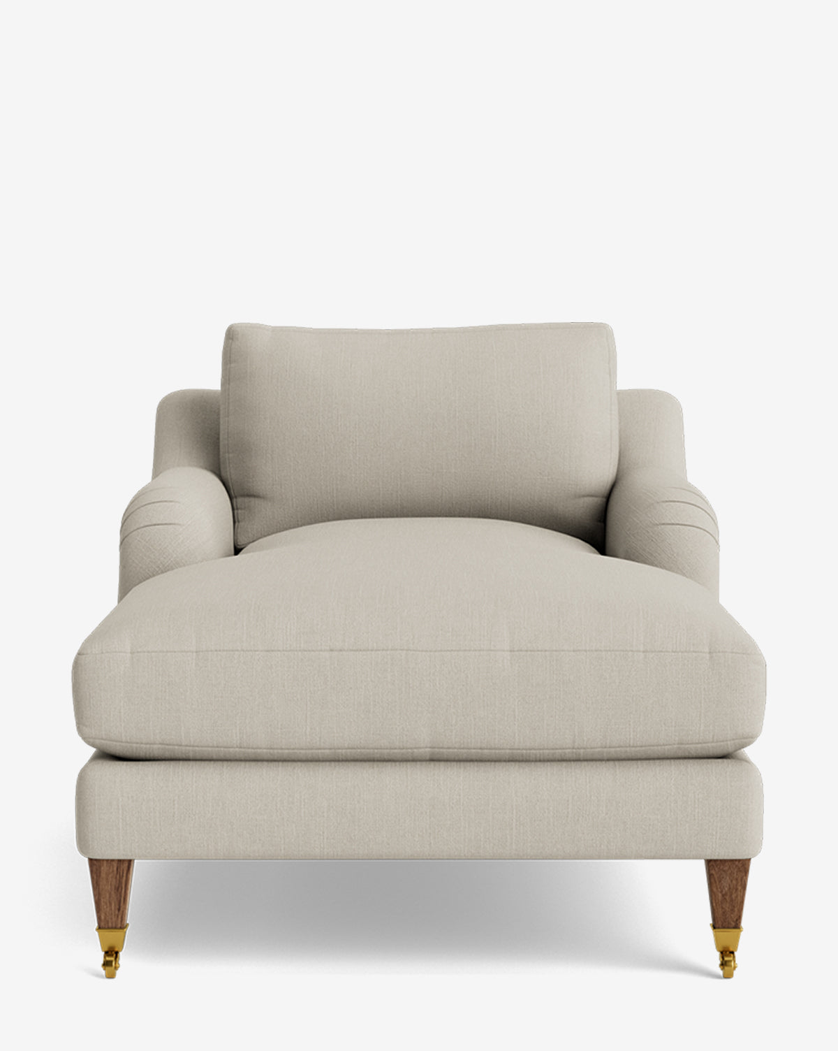 The Lucille English Roll Arm Lounge Chair features a plush, wide seat in light beige with a down-wrapped cushion and wooden legs, fronted by small brass casters—bringing classic elegance to any room, by McGee & Co. Set against a plain white background.