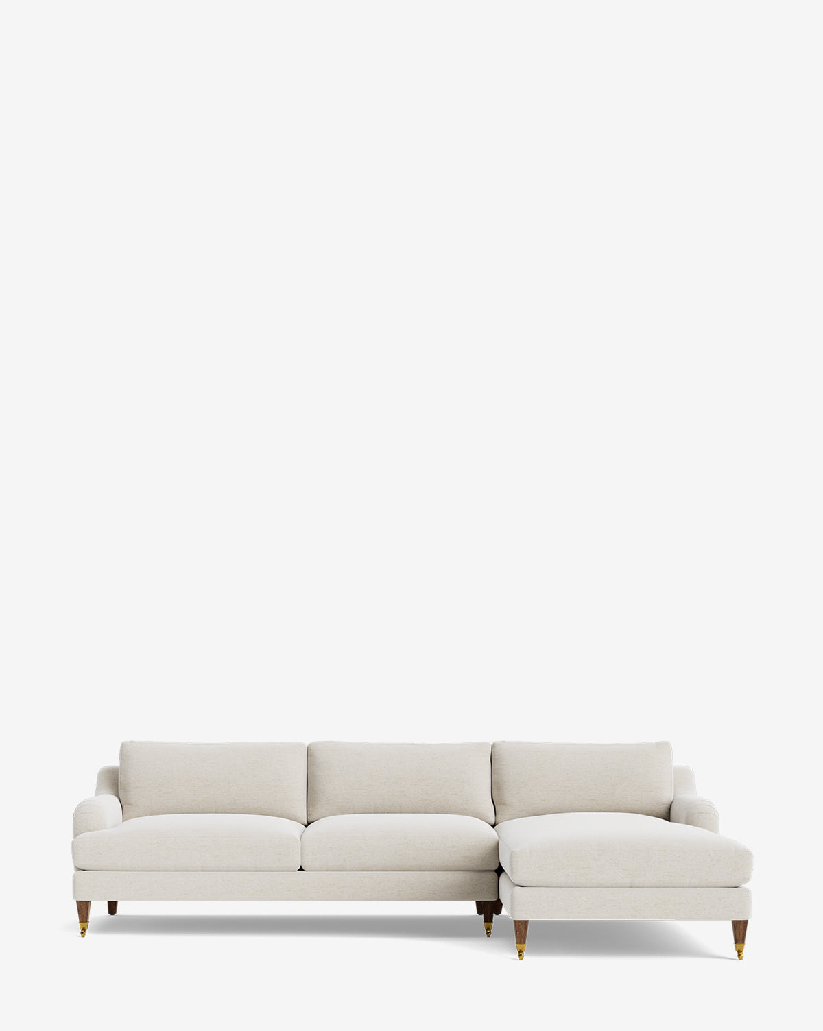 The Community Lucille English Roll Arm Right Chaise Sectional 107 is a modern, light beige customizable sofa with down-wrapped cushions and wooden legs with brass casters, shown against a plain white background. Vendixs