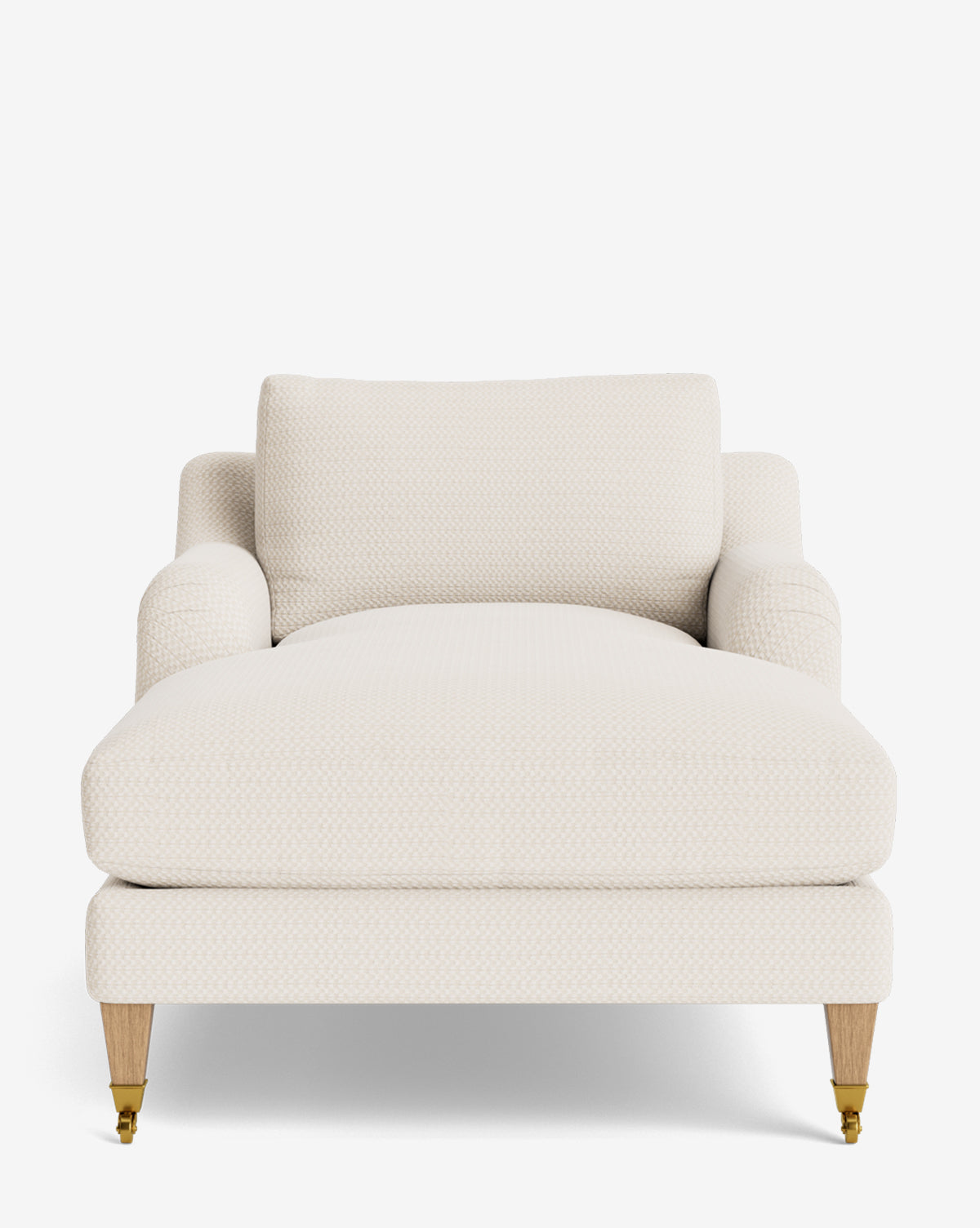A front view of the Lucille English Roll Arm Lounge Chair, a cream-colored, upholstered chaise with wooden legs and brass casters. This modern piece boasts a wide seat, low English roll arms, and a plush down-wrapped cushion for comfort, by McGee & Co.