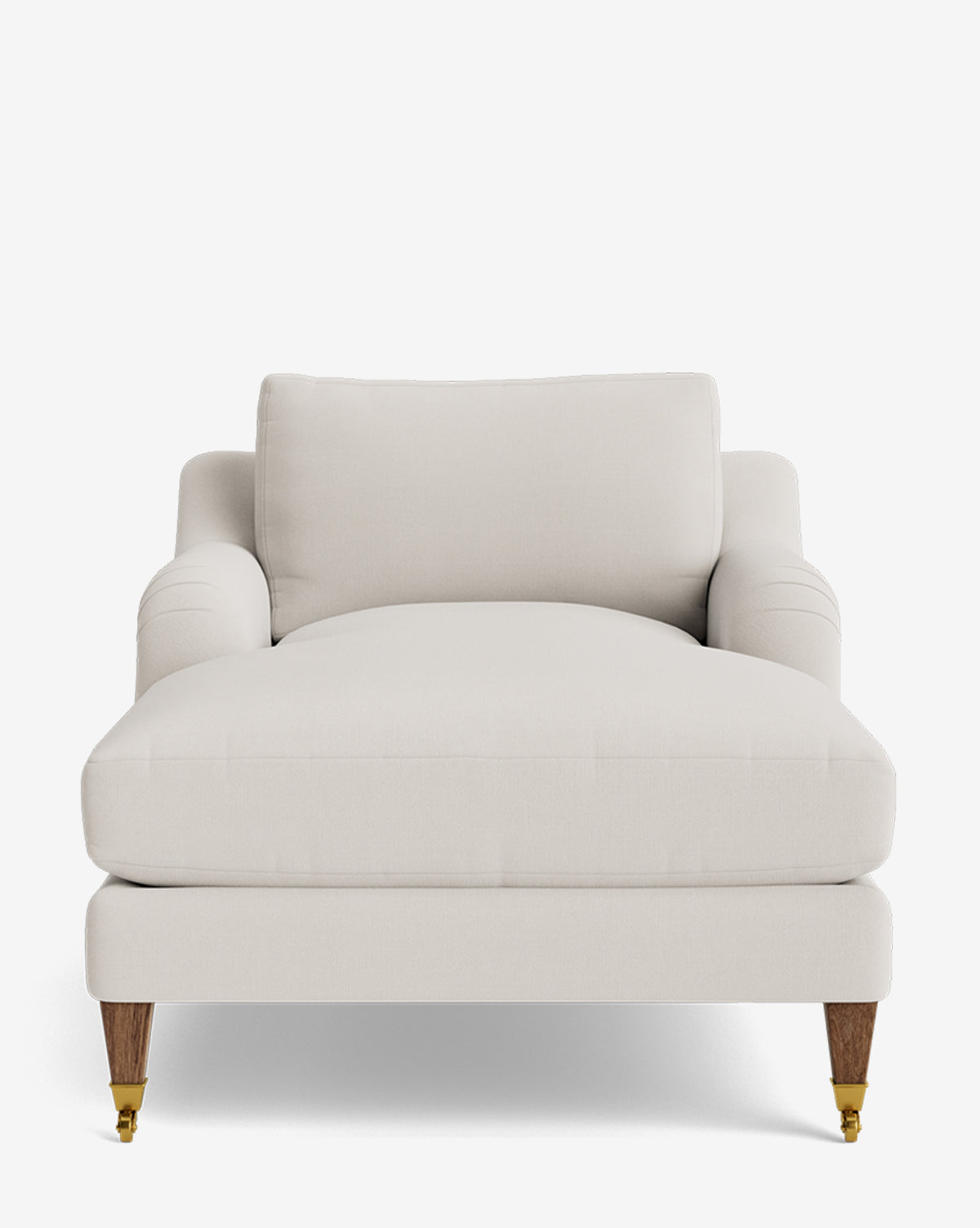 The Lucille English Roll Arm Lounge Chair is a plush, modern chaise in off-white upholstery with a deep seat, down-wrapped cushion, wooden legs, and brass front caster wheels, shown against a plain white background by Vendixs