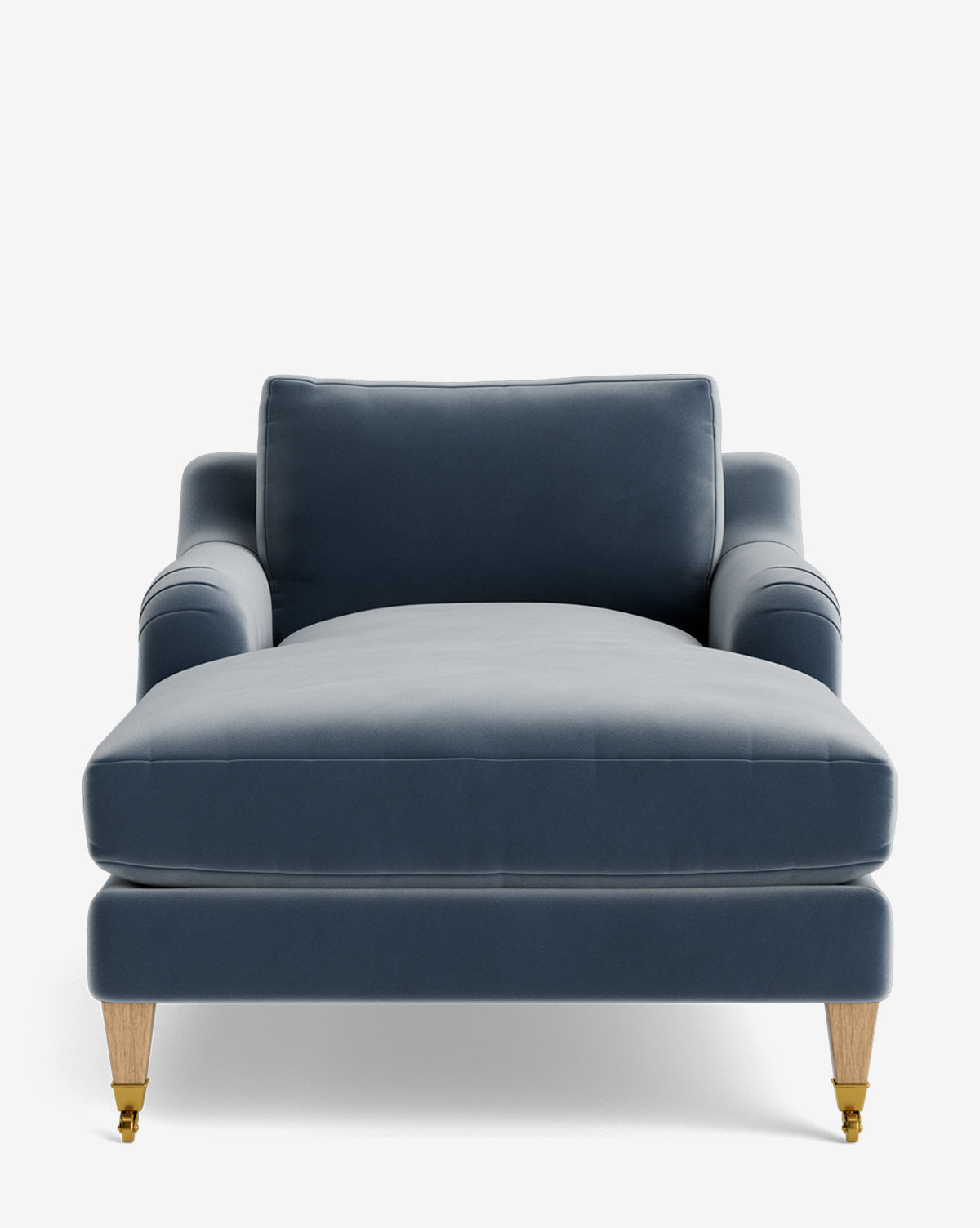 A front-facing view of the Lucille English Roll Arm Chaise Lounge, featuring blue upholstery, down-wrapped cushion, wooden legs, and brass castors on the front legs, isolated on a white background by McGee & Co.