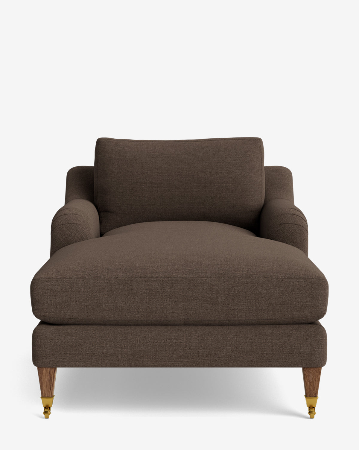 The Lucille English Roll Arm Lounge Chair features a front view in brown upholstery, wooden legs with two brass casters, a wide plush down-wrapped seat cushion, low rounded armrests, and a matching backrest cushion by McGee & Co.