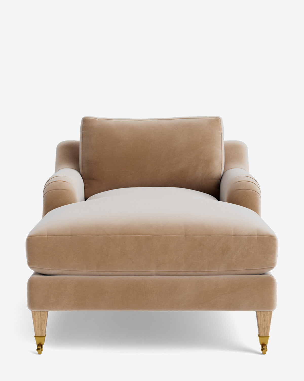 Front view of the Lucille English Roll Arm Lounge Chair with tan velvet upholstery, plush down-wrapped cushion, light wooden legs (two with brass casters), and customizable features, set against a plain white background by McGee & Co.